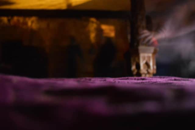 Amelia Barker took this photo of a ghostly hand touching a four-poster bed while ghost hunting at Medieval Manor in Gloucester in 2014. Credit: Amelia Barker/Amelia Rose Photography