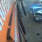 The wrecked police car after it collided with another vehicle and ploughed into a railing in Oldham. Photo: SWNS