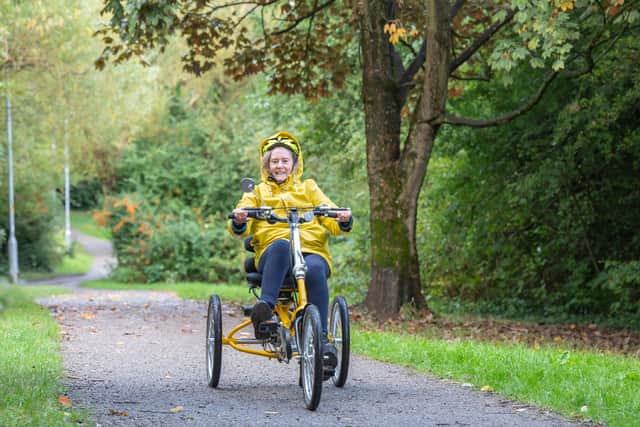 A cyclist riding a trike in a park. Photo: Transport for Greater Manchester