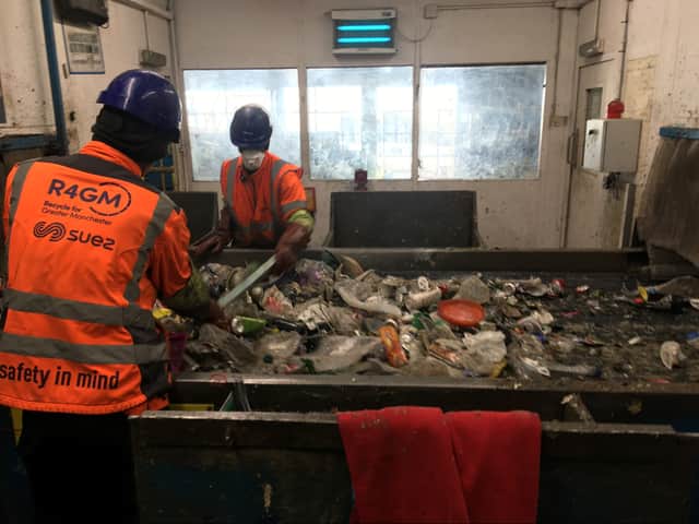Workers on a conveyor belt at the recycling facility. Photo: LDRS