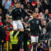 Cristiano Ronaldo of Manchester United walks out to the pitch with Marcus Rashford prior to the win against West Ham United (Photo by Ash Donelon/Manchester United via Getty Images)