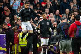 Cristiano Ronaldo of Manchester United walks out to the pitch with Marcus Rashford prior to the win against West Ham United (Photo by Ash Donelon/Manchester United via Getty Images)