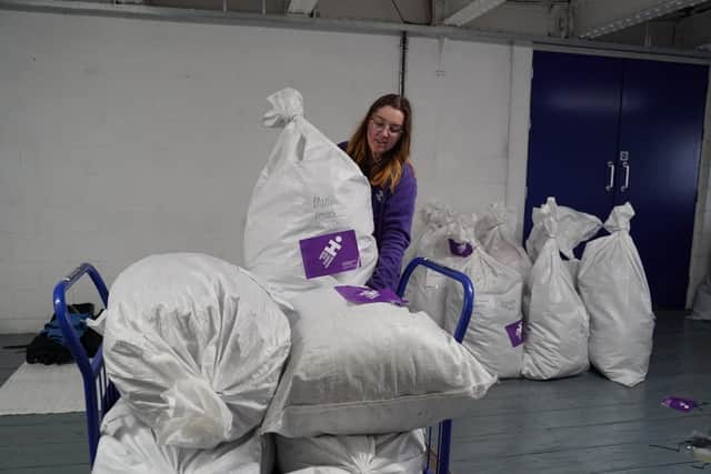 Bags of donated oats being sorted for distribution by Human Appeal as part of their Wrap Up campaign. Credit: Human Appeal