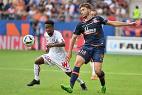 Lille’s English midfielder Angel Gomes fights for the ball with Montpellier’s French midfielder Leo Leroy  (Photo by Pascal GUYOT / AFP) (Photo by PASCAL GUYOT/AFP via Getty Images)