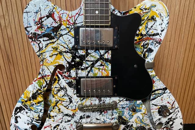 John Squire’s hand-painted guitar which is being auctioned