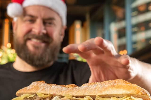 Alex Markham with the festive sandwich. Photo: Jonathan Pow