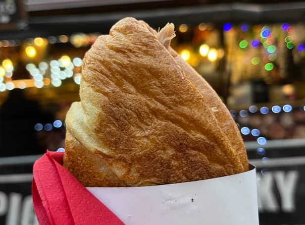 <p>The famous Yorkshire pudding wrap from Porky Pig at Manchester Christmas Markets 2022. Credit: Manchester World</p>