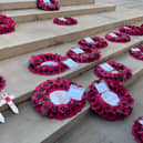 Poppy wreaths on the steps of the War Memorial on St Peter’s Square on Remembrance Sunday. Credit: Manchester World. 