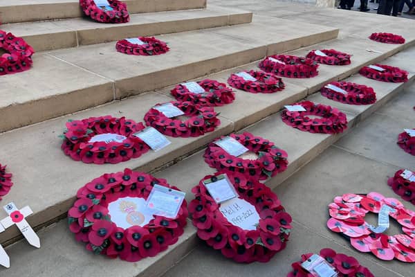 Poppy wreaths on the steps of the War Memorial on St Peter’s Square on Remembrance Sunday. Credit: Manchester World. 