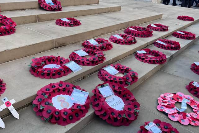 Poppy wreaths on the steps of the War Memorial on St Peter’s Square on Remembrance Sunday. Credit: Manchester World.