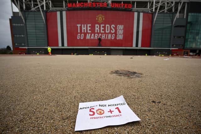 A discarded leaflet lies on the ground outside the stadium after the protest Credit: Getty