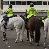 Mounted police move people away from the stadium on 2 May 2021 Credit: Getty