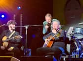 Mani on stage with renowned musician Michael Head (right). Photo: Paul Husband