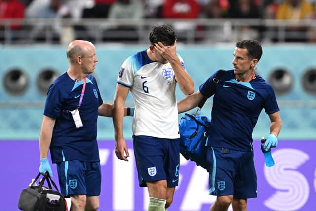 Maguire received medical treatement following Iran’s first goal. Credit: Getty.