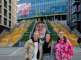 Helen Hardy (centre) with England women’s football team captain Leah Williamson and artist Charlotte Archer at Wembley. Photo: Getty Images/National Lottery