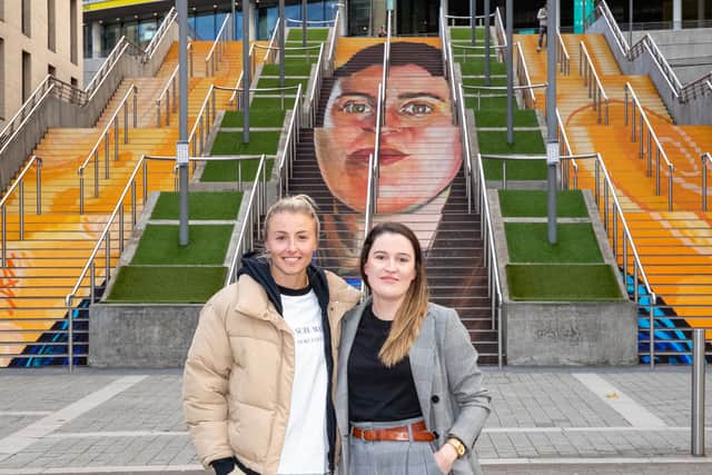 Lionesses captain Leah Williamson and Manchester Laces founder Helen Hardy at Wembley with the mural on the steps. Photo: Getty Images/National Lottery