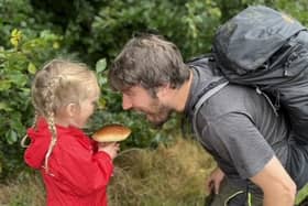   Jim Parums and his daugher foraging a mushroom Courtesy Jim Parums / SWNS