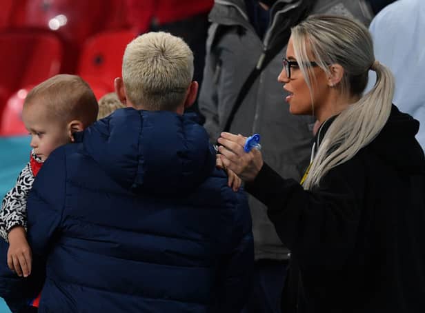 <p>England's midfielder Phil Foden (L) and his partner Rebecca Cooke (R) are seen in the stands at the end of the UEFA EURO 2020 Group D football match between Czech Republic and England at Wembley Stadium in London on June 22, 2021. (Photo by JUSTIN TALLIS / POOL / AFP) (Photo by JUSTIN TALLIS/POOL/AFP via Getty Images)</p>
