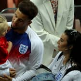 Kyle Walker of England chat with his wife Annie Kilner and his son following the 2018 FIFA World Cup Russia Semi Final match between England and Croatia at Luzhniki Stadium on July 11, 2018 in Moscow, Russia.  (Photo by Alexander Hassenstein/Getty Images)