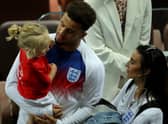 Kyle Walker of England chat with his wife Annie Kilner and his son following the 2018 FIFA World Cup Russia Semi Final match between England and Croatia at Luzhniki Stadium on July 11, 2018 in Moscow, Russia.  (Photo by Alexander Hassenstein/Getty Images)