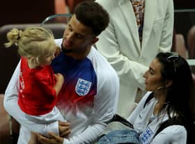 Kyle Walker of England chat with his wife Annie Kilner and his son following the 2018 FIFA World Cup Russia Semi Final match between England and Croatia at Luzhniki Stadium on July 11, 2018 in Moscow, Russia.  (Photo by Alexander Hassenstein/Getty Images)