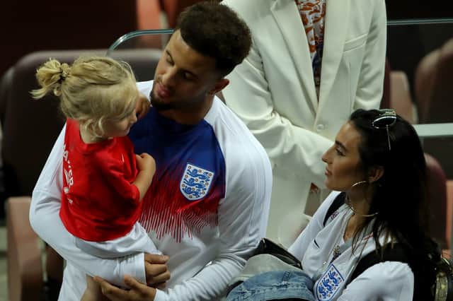 Kyle Walker of England chat with his wife Annie Kilner and his son following the 2018 FIFA World Cup Russia Semi Final match between England and Croatia at Luzhniki Stadium on July 11, 2018 in Moscow, Russia.  (Photo by Alexander Hassenstein/Getty Images)