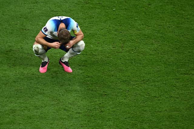 England’s forward #09 Harry Kane reacts to his team’s defeat in the Qatar 2022 World Cup quarter-final football match between England and France at the Al-Bayt Stadium in Al Khor, north of Doha.