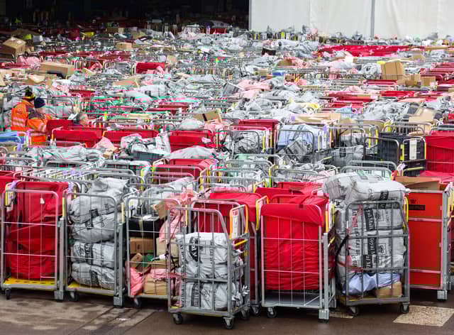 Letter and parcels pile up outside the Royal Mail centre in Bristol. Due to the postal strike along with the busy festive period lots of cages are seen outside the mail centre. Many of these parcels have been left outside for at least 17 hours.