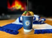 The Christmas dinner in a cup being offered by Stockport County