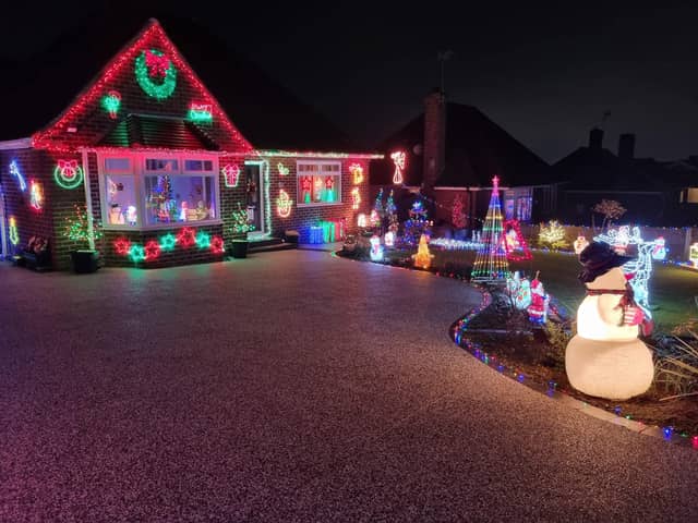 Julie and Mark Peacock from Derbyshire are raising money for Wythenshawe Transplant Centre with their stunning Christmas lights display. Credit: Julie Peacock