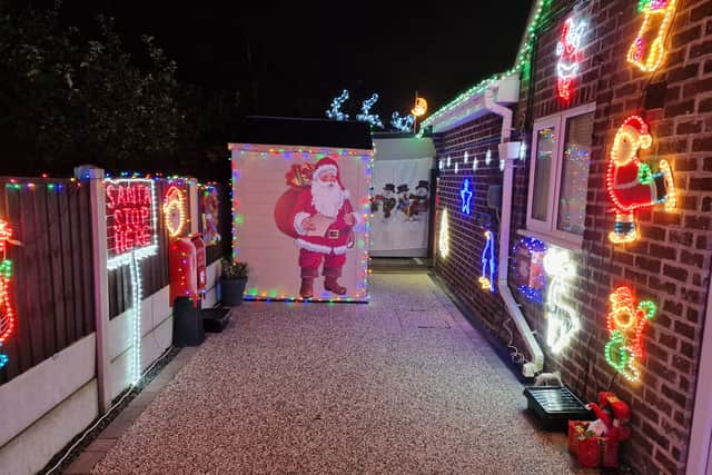 Julie and Mark Peacock have set up a Santa’s Grotto for the children coming to visit their Christmas lights. Credit: Julie Peacock