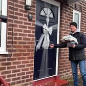 Footballer Nicky Butt about to surprise a resident in Gorton with a Christmas gift. Credit: Manchester World