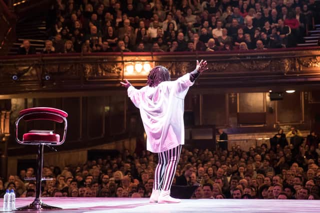 Whoopi Goldberg addresses a packed house at the London Palladium