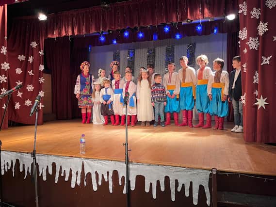 Ukrainian children in Ashton perform on stage during the St. Nicholas Day celebrations. Credit: Manchester World