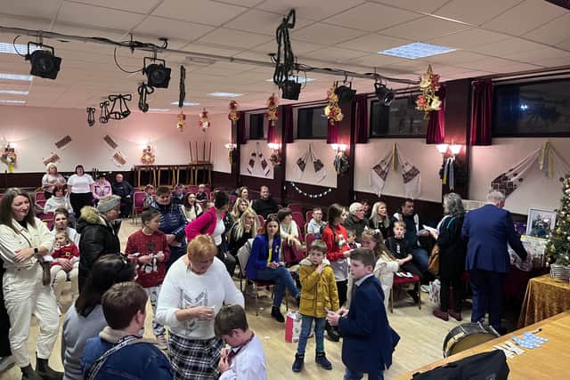Members of the Ukrainian community gather for a raffle competition at the end of their St Nicholas Day celebrations. Credit: Manchester World