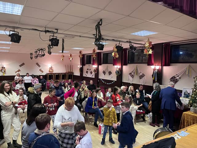 Members of the Ukrainian community gather for a raffle competition at the end of their St Nicholas Day celebrations. Credit: Manchester World