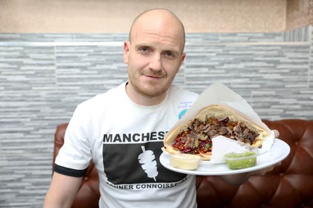 Des Breakey completes his 124th kebab in 30 days, pictured at Lebanese Shawarma Credit: SWNS