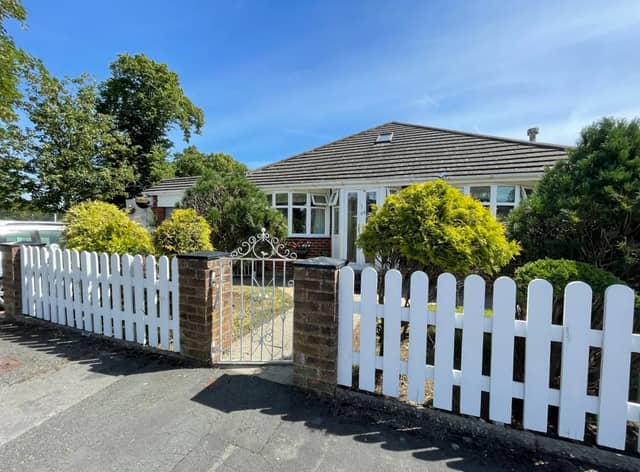 The unassuming bungalow has a swimming pool in its back garden 