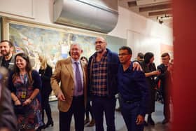 Eric Cantona and Sir Alex Ferguson and Michael Browne at the launch of From Moss Side to Marseille: The Art of Michael Browne and Eric Cantona Credit: Nathan Chandler