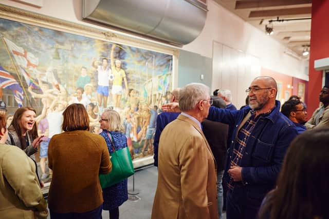 Eric Cantona at the launch of his joint exhibition at the National Football Museum, seen here talking to Sir Alex Ferguson Credit: Nathan Chandler