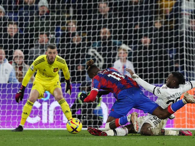Wilfried Zaha praised Aaron Wan-Bissaka after Manchester United drew 1-1 with Crystal Palace. Credit: Getty.
