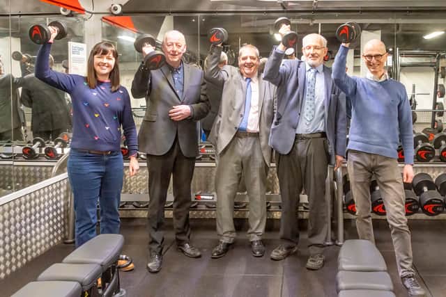 Local councillors test out the new dumbbells at the Wythenshawe Forum gym. Credit: Everyone Active