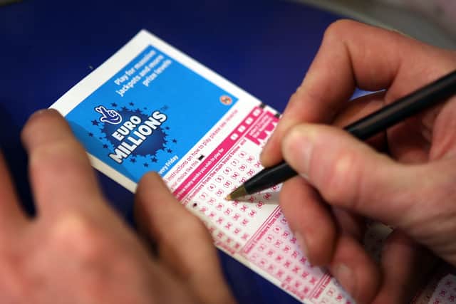 A punter fills out a EuroMillions ticket in London. (Photo by Peter Macdiarmid/Getty Images)