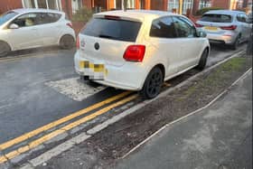 A driver parked on double yellow lines outside Cadishead Primay School. Credit LDRS