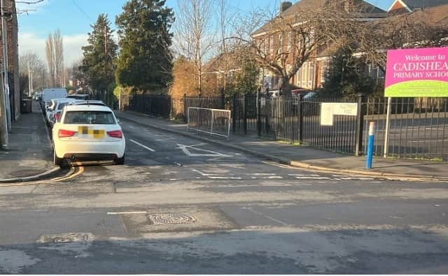 A driver parked on double yellow lines outside Cadishead Primary School. Credit LDRS