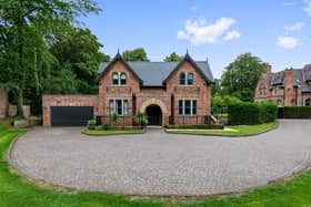The stunning exterior of the property set back from the road
