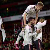United celebrate Rashford’s goal against Arsenal on Sunday