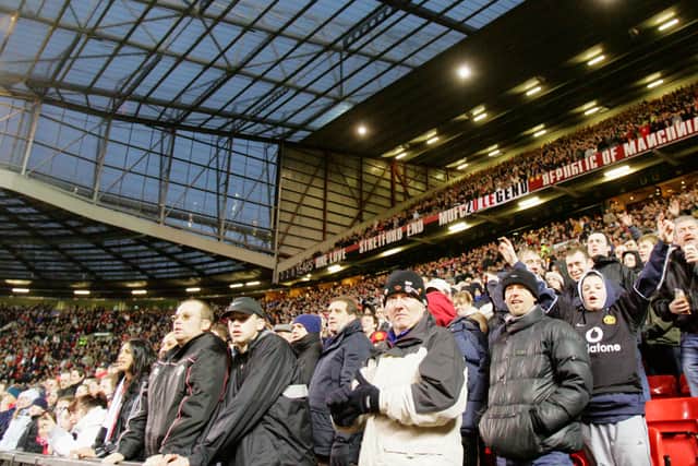 Manchester United fans at the Stretford End. Photo: Manchester United via Getty Images