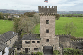 Front of the castle towers where the property resides
