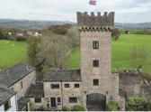 Front of the castle towers where the property resides